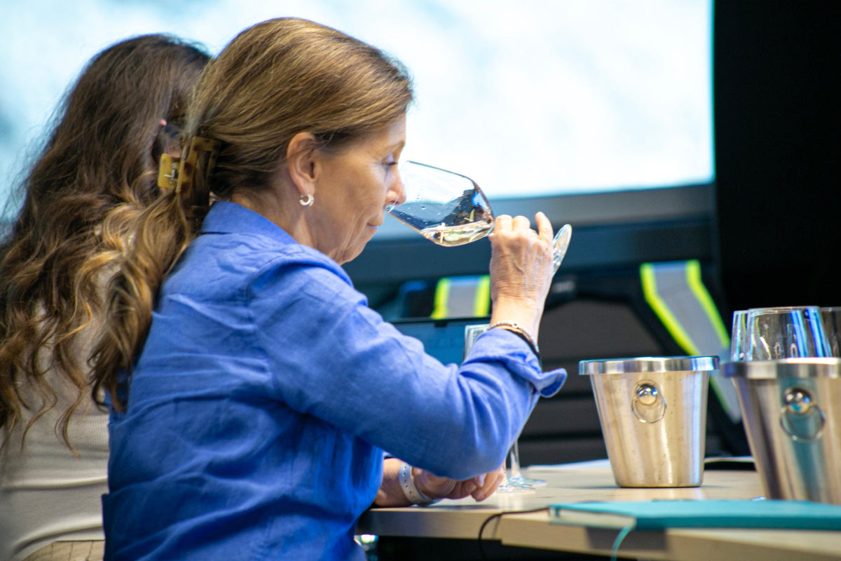 Woman sniffing white wine